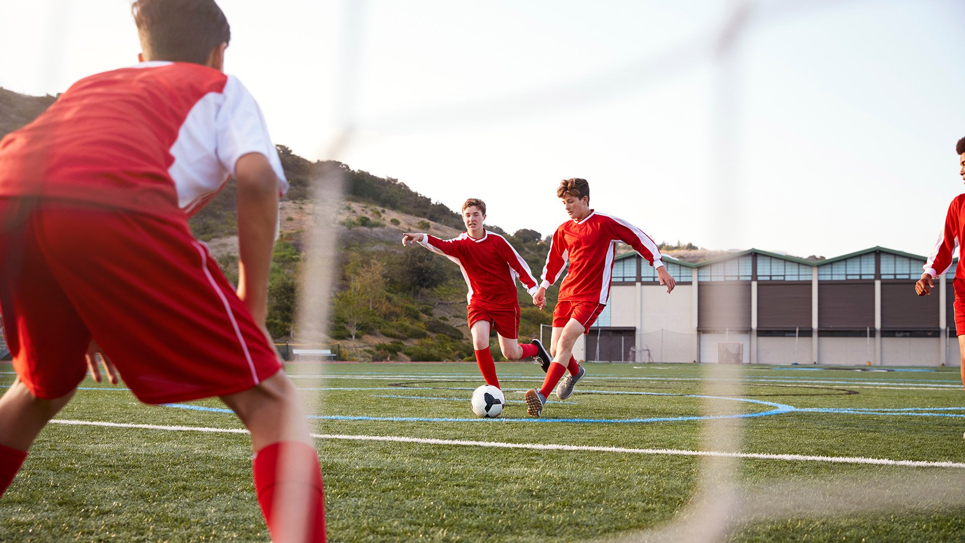 Group-of-Male-High-School-Students-Playing-in-Soccer-Team