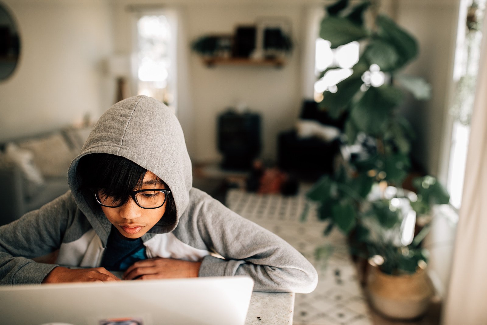 Canva - Kid doing homework on laptop at home (1)