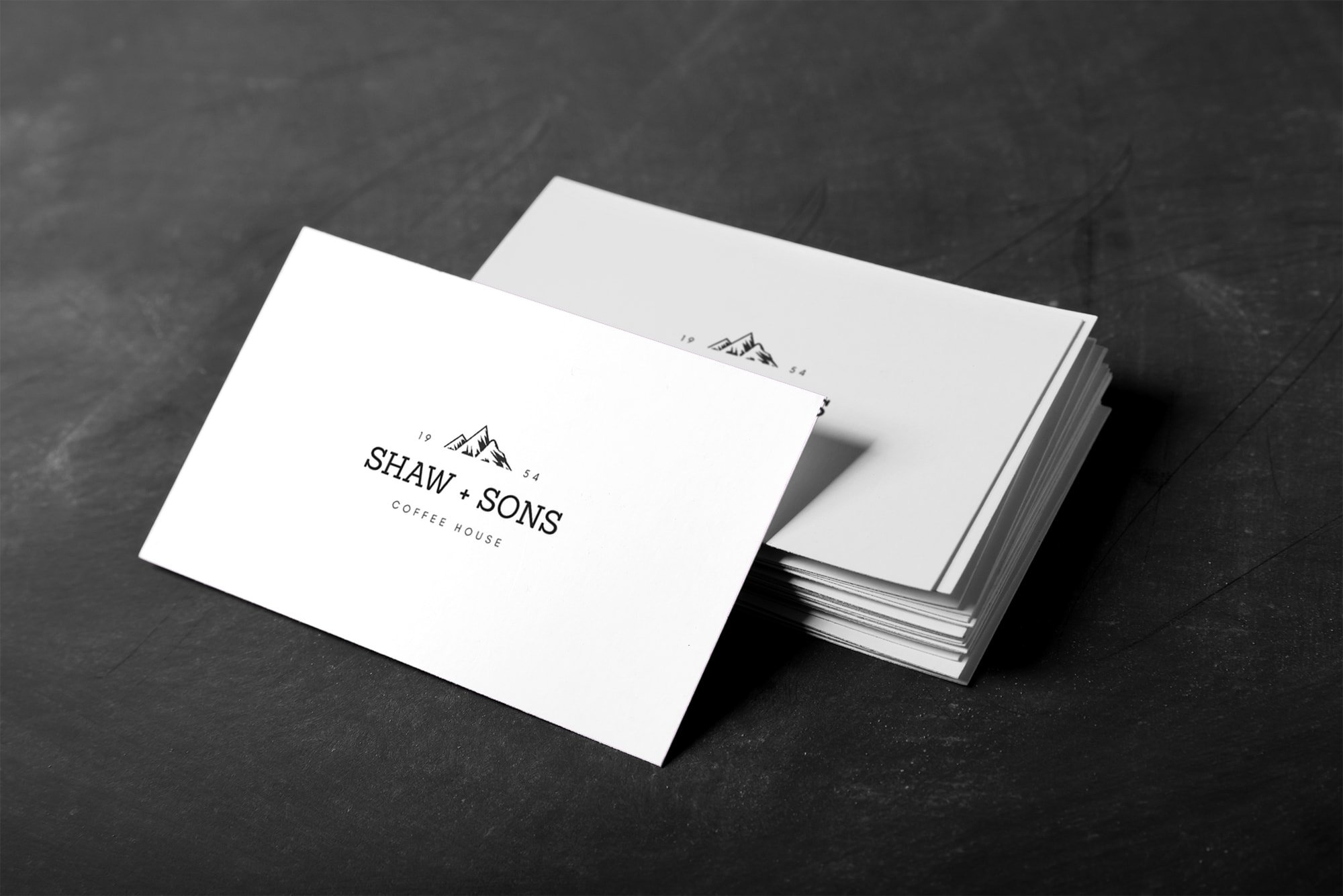 A stack of business cards designed with Canva