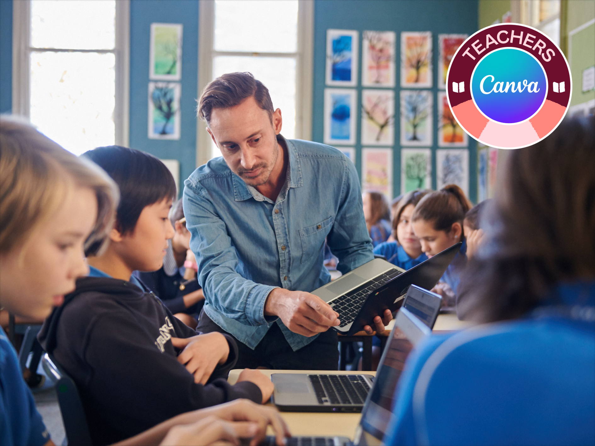 Male teacher in classroom with primary school children