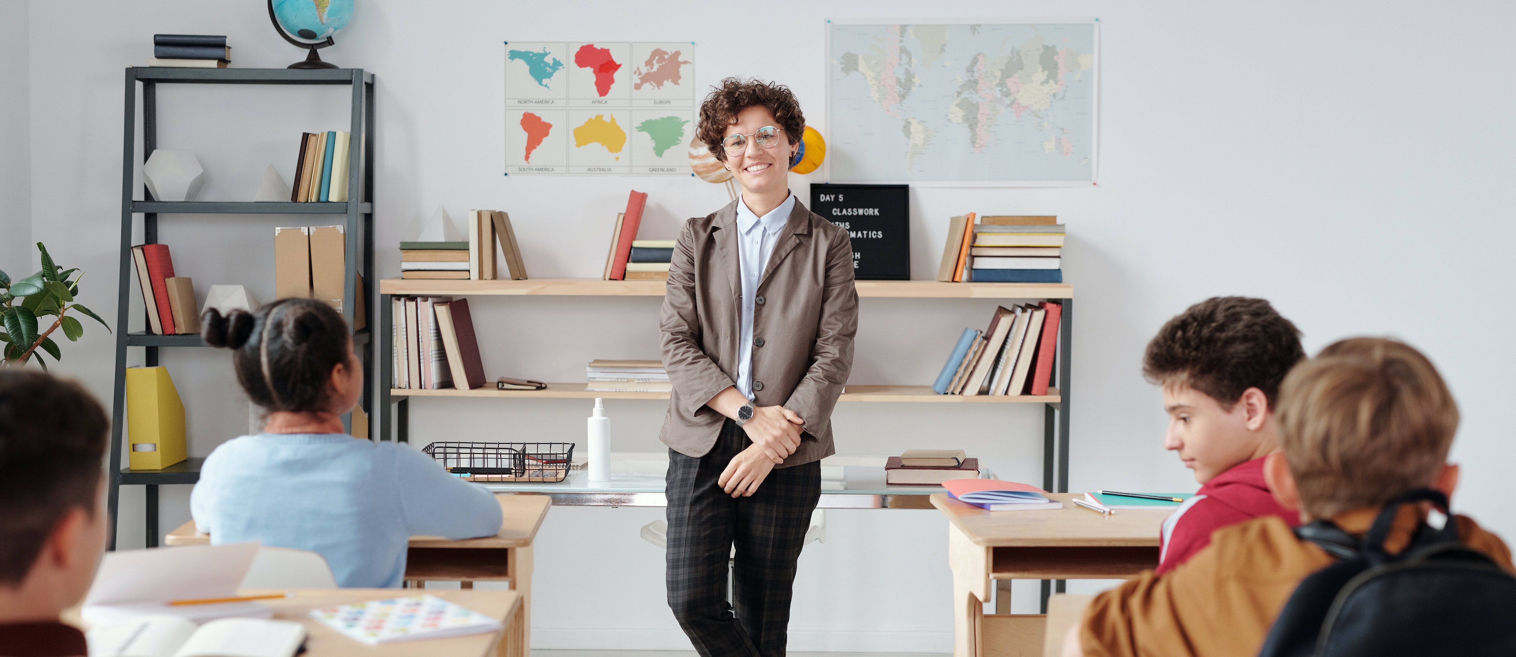 A Teacher Standing in the Classroom